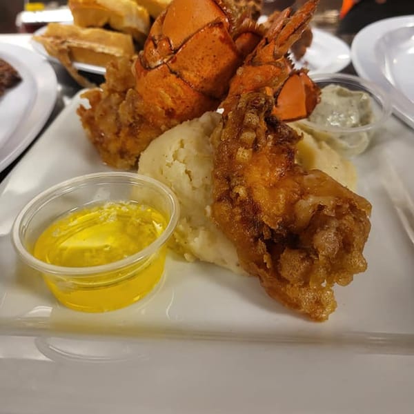 Southern Fusion Bistro's fried lobster and shrimp with mashed potatoes, butter, and sauce.